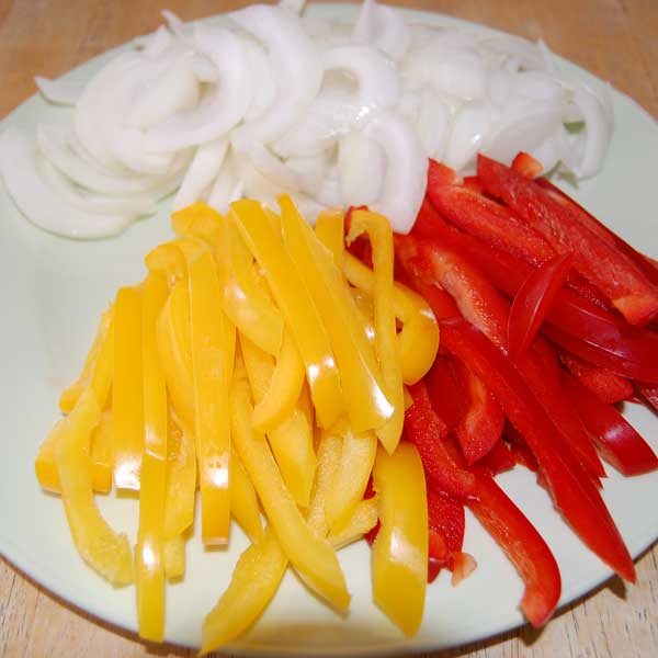 Photo of sliced onion and bell peppers
